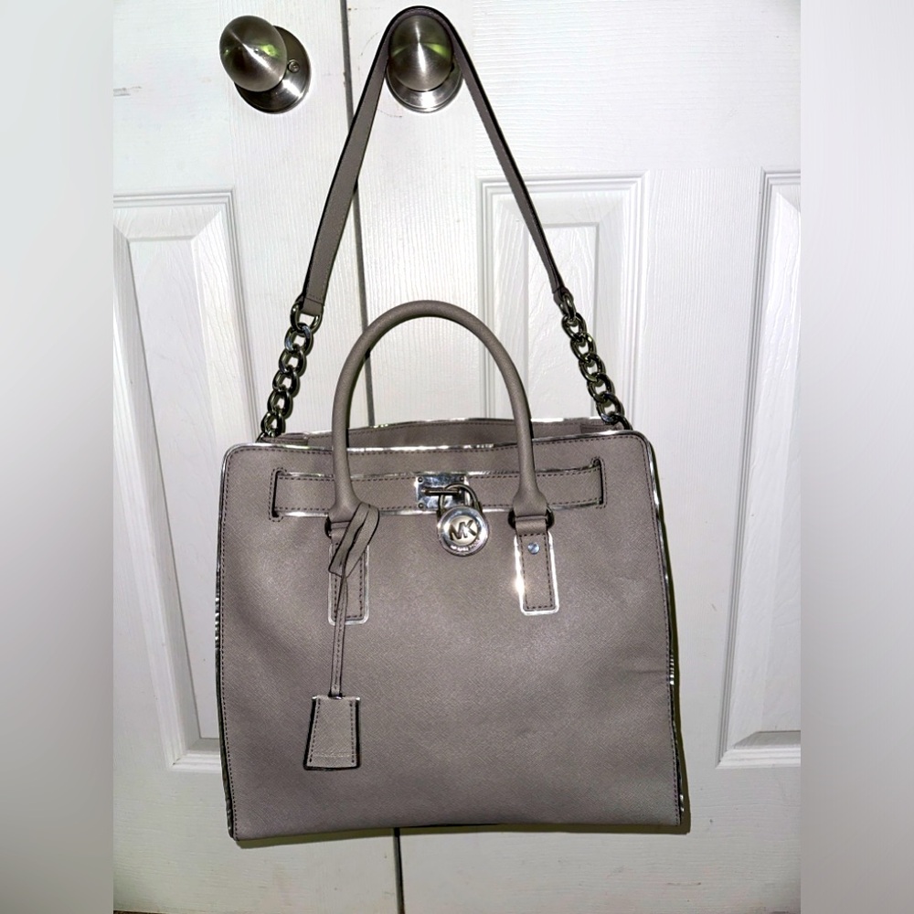 Silver Michael Kors crossbody/satchel with lock and key